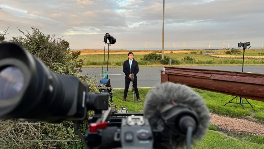Camera and microphone prepared for an outdoor presenter interview